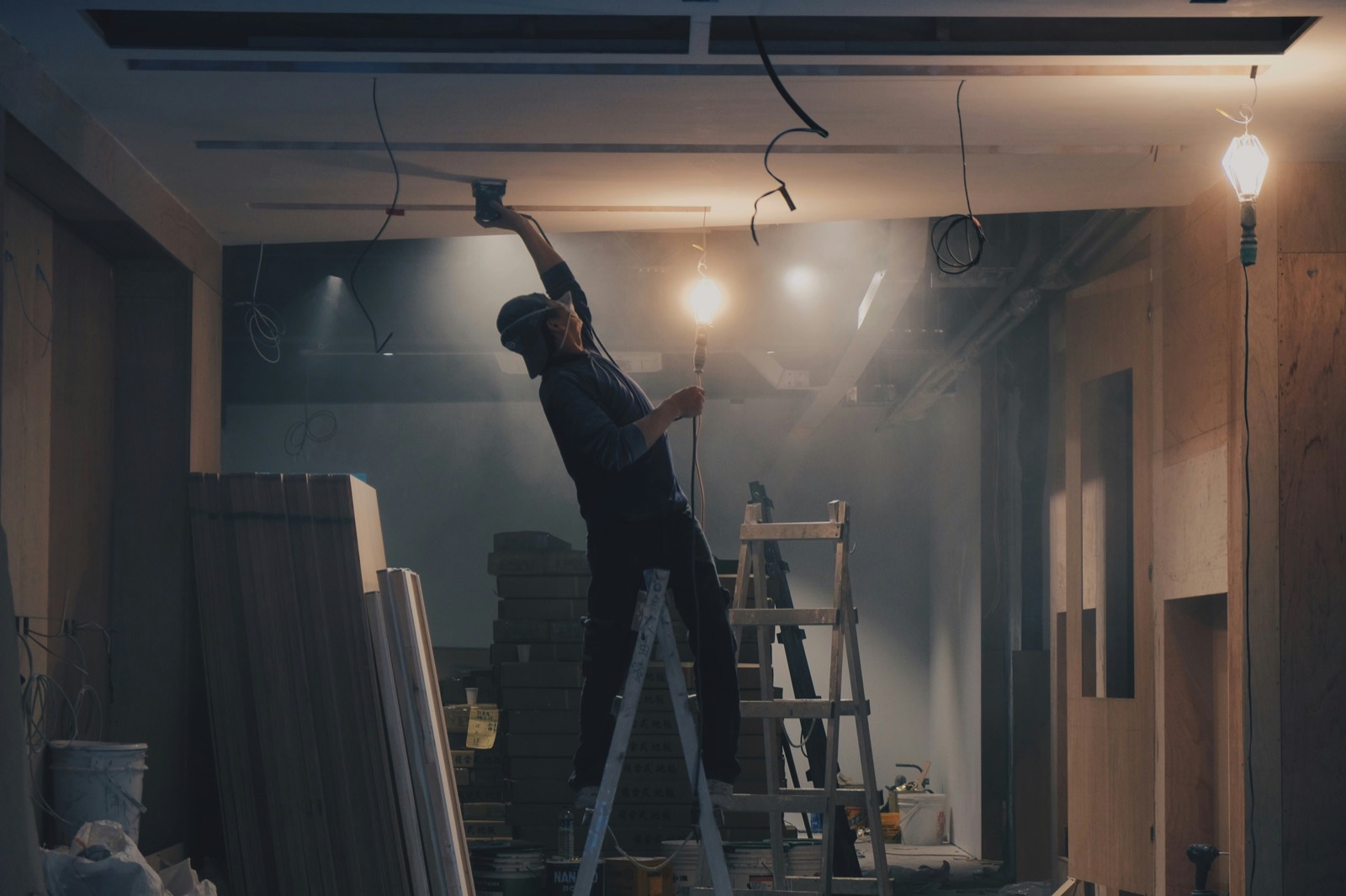 NKC craftsman finishing a ceiling on a renovation site